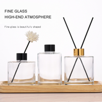 Vente en gros de bouteille diffuseur ronde de luxe personnalisée de 100ml 200ml bouteille vide en verre diffuseur d'anche avec couvercles