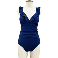 Maillot de bain une pièce bleu marine imprimé à volants et col en V, avec dos lacé orné de cristaux et effet ventre plat, pour une élégance classique au bord de la piscine