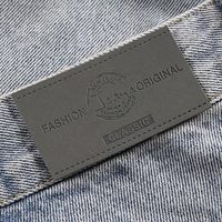 Étiquettes en cuir PU personnalisées avec logo en relief pour vêtements, jeans