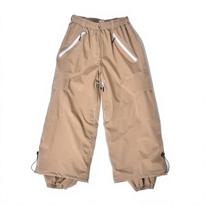 Pantalon de neige beige style super ample, chauffant, isolé, respirant, coupe-vent, finition imperméable, poches zippées sécurisées, jambe ajustable - Product Image 1