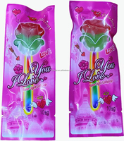 Vente en gros usine 30 pièces Sucettes phosphorescentes en forme de rose Bonbons fluorescents Faveurs de fête de la Saint-Valentin Remplissage fruité dur