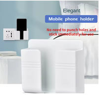 Support mural pour téléphone portable multifonctionnel populaire, nouveau, adhésif, support de chargeur mobile avec télécommande, support mural en plastique