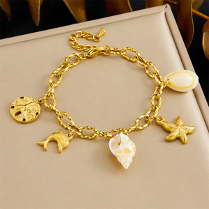 Fashionable Gold Plated Dolphin Starfish Seashell Charm Bracelet Women's Ocean Theme Jewelry Gift - Product Image 1