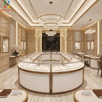 Kiosques de présentation de bijoux de luxe au design moderne et personnalisé Hontay, design incurvé, robustes, de haute qualité, en acier inoxydable doré trempé