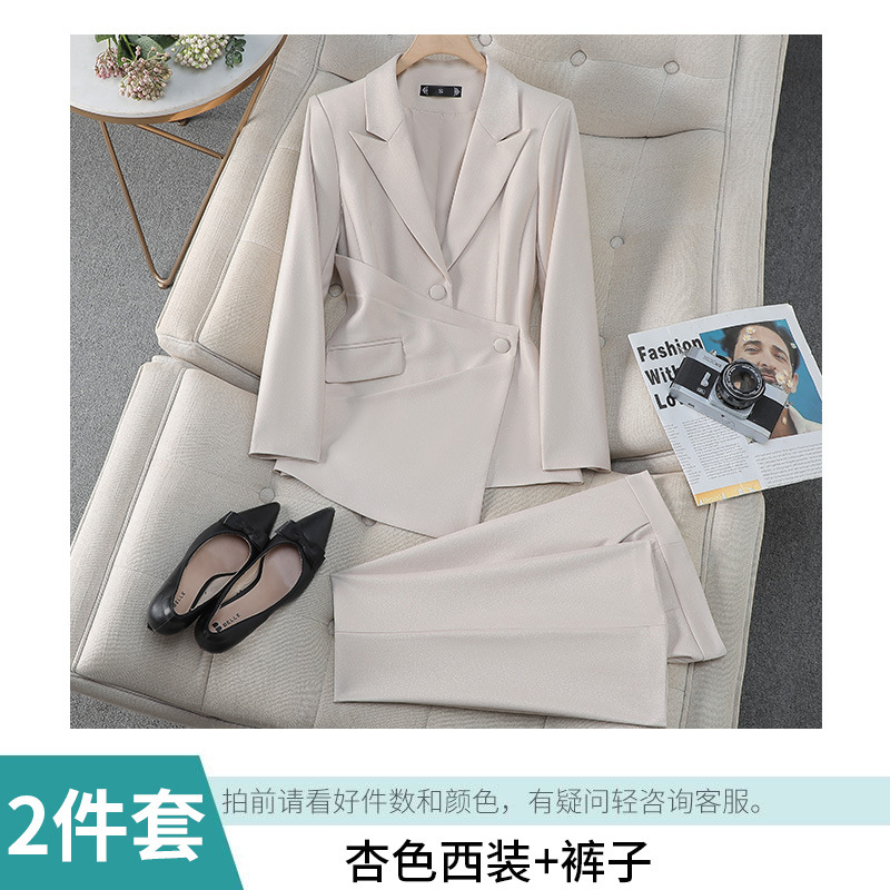 apricot-colored suit with slightly flared trousers