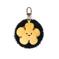 Porte-clés en peluche oursin noir audacieux, breloque de sac mignonne avec centre jaune, jouet unique contrastant pour le streetwear