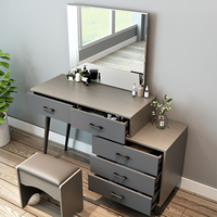 Commode moderne en panneaux de bois gris avec rangement et coiffeuse de maquillage