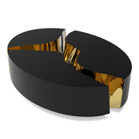 Table basse contemporaine inspirée des formations karstiques avec finition laquée noire et intérieur en laiton poli
