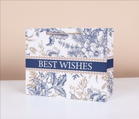 Sac cadeau rigide en carton ivoire classique de qualité supérieure avec logo personnalisé, emballage en carton haut de gamme écologique pour la vente au détail en boutique