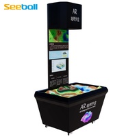 Table de sable géographique numérique Seeball avec affichage holographique 1000x1000, interaction gestuelle, thème volcanique