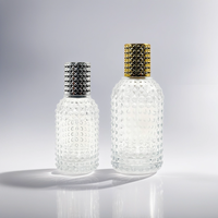 Fabricant à vendre Pompe de pulvérisation au design unique Bouteille en verre de parfum en forme de cylindre rond de 50ml