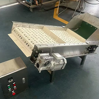 Transportador de cinta modular con deflector para transportar cubitos de hielo Filtrado automático de escoria de hielo y transportador de material de elevación