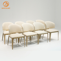 Chaise de salle à manger en acier inoxydable de luxe léger, avec dossier en cuir véritable et motif tressé artisanal
