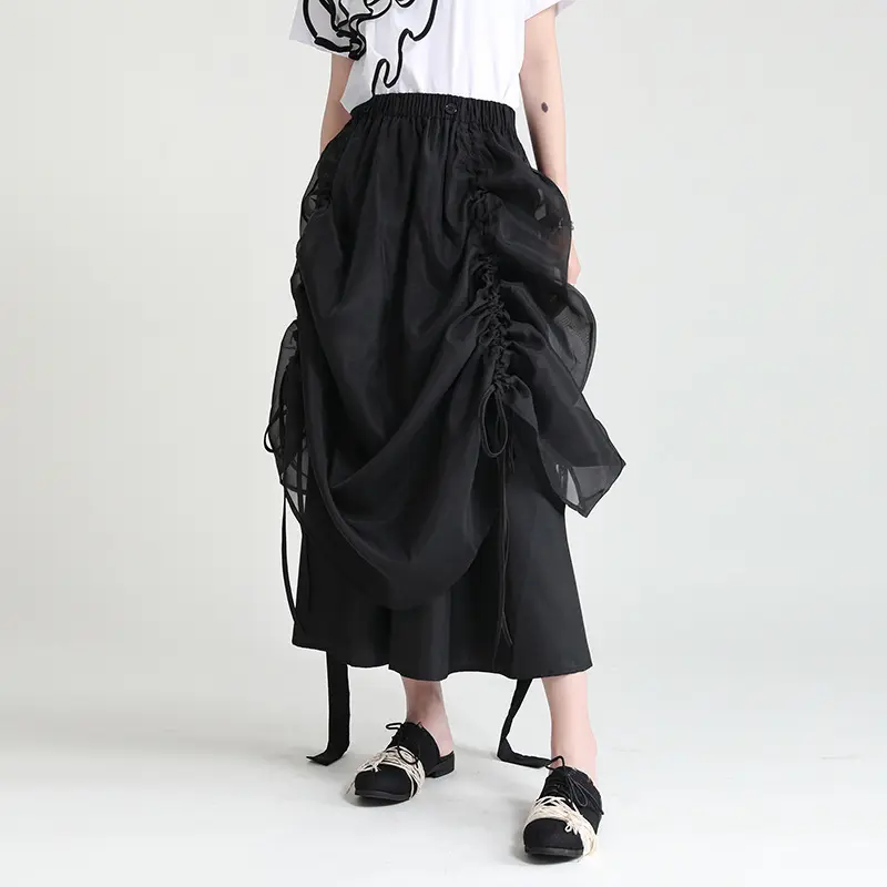 Keluaran baru 2024 musim panas rok panjang sedang baru desain renda rok setengah berlipat gaya peri hitam putih untuk wanita