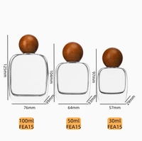 Vente en gros de flacons de parfum en verre exquis de 30 ml, 50 ml, 100 ml avec pulvérisateur à pompe à sertir, bouchon en bois, boîte cadeau personnalisée