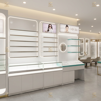 Vitrine d'exposition personnalisée en acier inoxydable et verre trempé pour magasin d'optique, éclairage LED, étanche, robuste, luxe, vente au détail