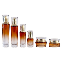 Set Kemasan Perawatan Kulit kaca kosong kustom mewah Set botol Losion Matte selesai Krim Serum Diffuser tutup sekrup cetak layar