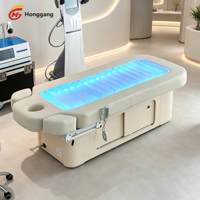Table de massage électrique intelligente avec design incurvé et fonction de levage pour spa et soins