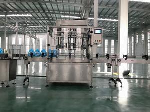 12 buses huile lubrifiante peser la distribution de liquide 2 têtes jus bière bouteille en verre machine de remplissage volumétrique avec capsuleuse 1 ensemble - Product Image 6