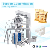 Machine d'emballage alimentaire automatique verticale avec système de pesage, remplissage et scellage pour guimauves, snacks et produits granulés