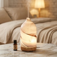 Diffuseur d'huiles essentielles électrique en verre effet roche sablée avec 7 lumières LED pour une utilisation intérieure à la maison