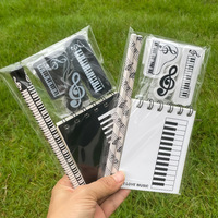 Spezielles Musik-Schreibwarenset für den Außenhandel: Klavier-Musiknoten-Radiergummi, Spiralblock, Bleistift, Geschenktasche, Kombinationsset