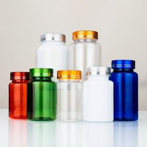 <b>Small</b> <b>bottles</b> of health supplements with caps, repackaged and sealed, including calcium tablets and capsules, in transparent - Product Image 1