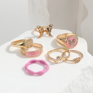 ZL-173 Kit de Joyería para Mujer, Anillos de Aleación Dorada con Cristales, Diamantes de Imitación y Esmalte en Forma de Ojo de Mariposa y Corazón, 7 Piezas - Product Image 4