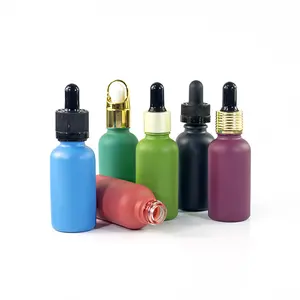 Bottiglia di olio essenziale nero verde giallo contagocce rosso serigrafia confezione cosmetica flacone contagocce in vetro cilindrico