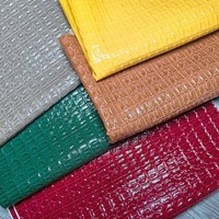 Cuir PU Jun Rong à effet crocodile bicolore brillant, matériau décoratif adapté aux bagages, aux trousses de maquillage et aux housses d'ordinateur portable