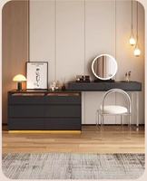 Bureau de toilette moderne noir avec plateau en verre, éclairage LED intégré, plusieurs tiroirs et armoire latérale pour chambre à coucher