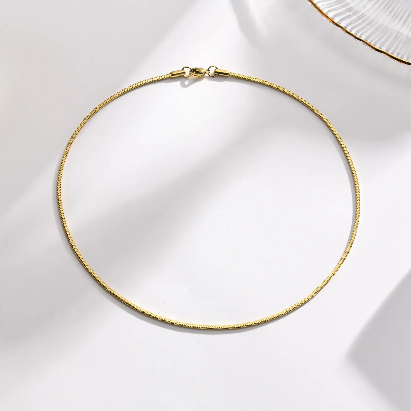 Großhandel minimalistischer 18K Goldplattiert runder Schlangenkette-Halsband Halskette Damen Herren Edelstahl wasserdichter Schmuck 1,0/1,2 mm
