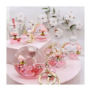 Porte-clés dessin animé cerisier et beignet, porte-clés liquide sable mouvant Sakura, pendentif de voiture, accessoires de sac, cadeaux pour enfants - Product Image 1