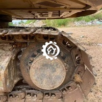 Excavatrice compacte sur chenilles d'occasion CAT 310 avec moteur puissant et performances hydrauliques fluides