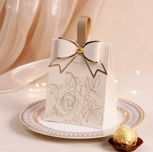New cream-white <b>wedding</b> candy <b>box</b> with a retro French-style hand-held champagne-colored bow texture candy <b>box</b> design - Product Image 5
