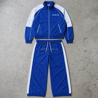 Ensemble décontracté deux pièces pour homme, haut à manches longues avec fermeture éclair et pantalon à cordon de serrage, couleurs bleu et blanc, OEM ODM