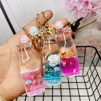Porte-clés Bouteille de Lait avec Animaux Marins Flottants - Pendentif Mignon Créature Marine de Dessin Animé pour Accessoires de Sac, Cadeau