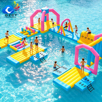 Parc aquatique flottant modulaire gonflable avec toboggan, parcours de jeux aquatiques durable pour les entreprises de parcs aquatiques