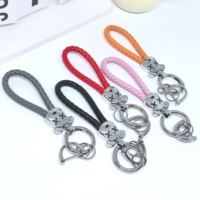 Porte-clés mignon en forme de tête d'ours tressé en cuir avec mousqueton, corde en PU colorée, anneau en alliage de zinc, pour femmes et couples, tendance et écologique