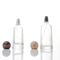 Flacon de parfum rond de luxe 100 ml 50 ml avec boîte, bouchon en bois, logo personnalisé, emballage de parfum unique, OEM ODM