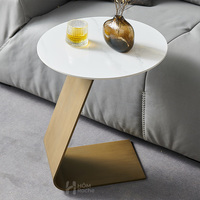 Table basse ronde personnalisée en marbre et pierre frittée avec piètement en acier inoxydable pour hôtel, villa, appartement, café