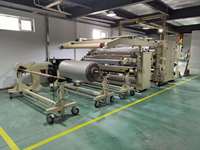Machine de stratification pour colle thermofusible.