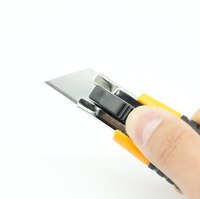 Cutter de sécurité de haute qualité avec manche en plastique et TPR, couteau utilitaire avec coupe-ceinture