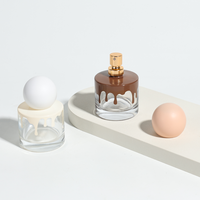 Flacons de parfum ronds vides personnalisés par le fabricant, luxueux et exquis, en verre transparent de 30 ml, avec vaporisateur.
