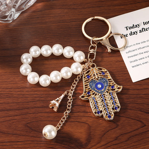 Factory Wholesale Evil Eye Hamsa Hand <strong>Keychain</strong> Pearl Beaded Key Ring Metal Hollow Pendant Fashion Bag Charm for Women Gift - Product Image 5