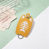 Porte-clés en cuir PU motif chat de dessin animé mignon, étui de protection portable pour clés avec design extractible motif arête de poisson pour usage quotidien