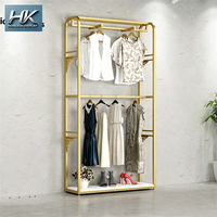 Étagère de présentation de vêtements minimaliste sur mesure, en métal, de haute qualité, durable, pour boutique de vêtements pour femmes, magasin, centre commercial