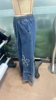 Celana Jeans Wanita Eropa Amerika 2026 Bordir Bunga Model Kaki Lebar Pinggang Tinggi Ujung Raw Fringe Panjang Menyentuh Lantai Gaya Street Style