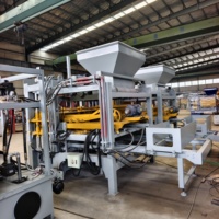 Machine de fabrication de blocs de béton hydraulique entièrement automatique QT4-15, machine à pavés creux et briques autobloquantes pour usine