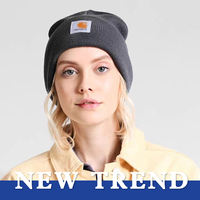 Bonnet d'hiver unisexe Bonnet tricoté Chapeau en acrylique uni à la mode Logo personnalisé Vente en gros OEM ODM pour les scènes d'affaires à la plage Vous garde au chaud